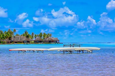 Tahitian canoes anchored out of water in Bora Bora