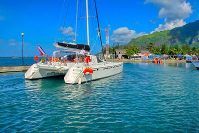 Catamaran coming into Tahiti harbor to dock