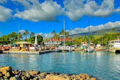 Lahaina Harbor with catamaran talking on passengers at dock